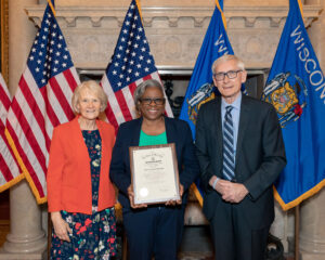 Constance Alberts of Bank On Greater Milwaukee with WI Governor Tony Evers and First Lady Kathy Evers