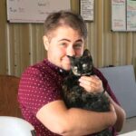 Adam Bridges photo with a cat